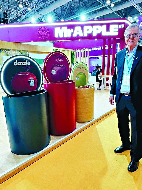 Peter Lund stands before a display showcasing New Zealand’s largest apple marketer and Zespri kiwifruit at AsiaWorld-Expo during the 2025 Asia Fruit Logistica in Hong Kong.