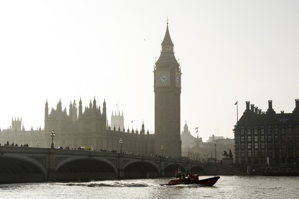 An RNLI lifeboat is piloted down the River Thames backdropped by the Palace of Westminster and The Elizabeth Tower more commonly known as 'Big Ben' in London on March 4, 2026. (Photo by Brook Mitchell / AFP)