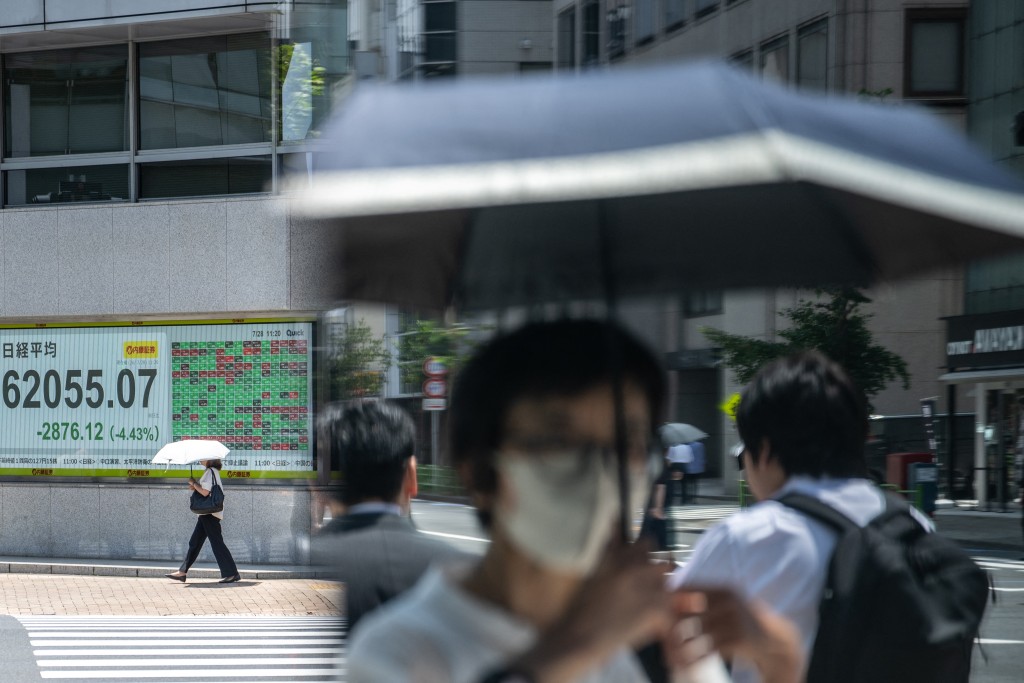 An electronic quotation board displays the Nikkei Stock Average on the Tokyo Stock Exchange in Tokyo on July 28, 2026. (Photo by Philip FONG / AFP)