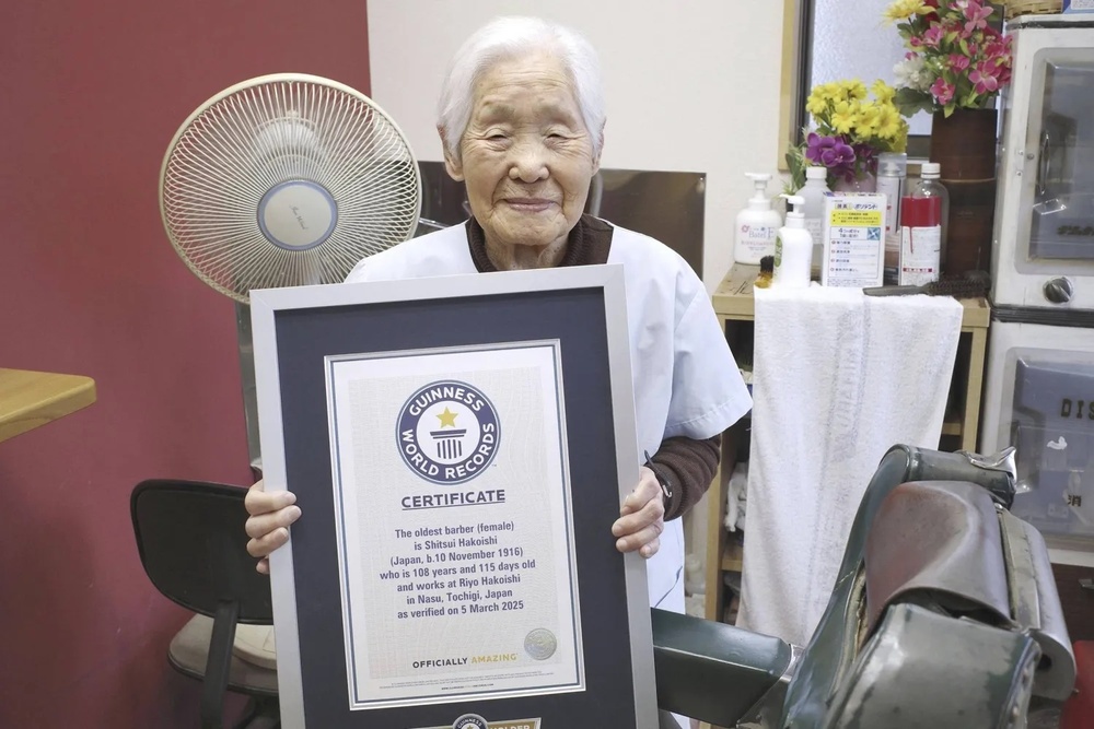 Shitsui Hakoishi, 108, poses for a photo with a Guinness World Records certificate recognizing her as the world's oldest female barber, at her shop in Nakagawa in Tochigi Prefecture, eastern Japan, on Wednesday March 5, 2025. (Kyodo Photo via AP) Shitsui Hakoishi, 108, poses for a photo with a Guinness World Records certificate recognizing her as the world's oldest female barber, at her shop in Nakagawa in Tochigi Prefecture, eastern Japan, on Wednesday March 5, 2025. (Kyodo Photo via AP)
