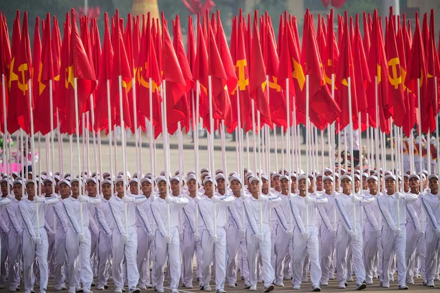Vietnamese march with Vietnam National Flags takes part in a military parade marking Vietnam's 80th National Day anniversary in Hanoi, Vietnam, September 2, 2025. Vincent Thian/Pool via REUTERS