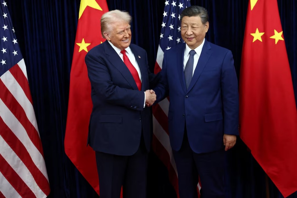 U.S. President Donald Trump greets Chinese President Xi Jinping as they hold a bilateral meeting at Gimhae International Airport, on the sidelines of the Asia-Pacific Economic Cooperation (APEC) summit, in Busan, South Korea, October 30, 2025. REUTERS/Evelyn Hockstein