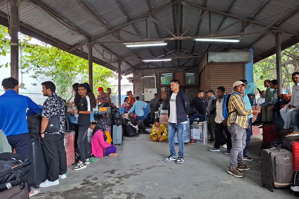 Stranded passengers wait as operations remain halted at the Tribhuvan International airport in Kathmandu on September 10, 2025. (AFP)