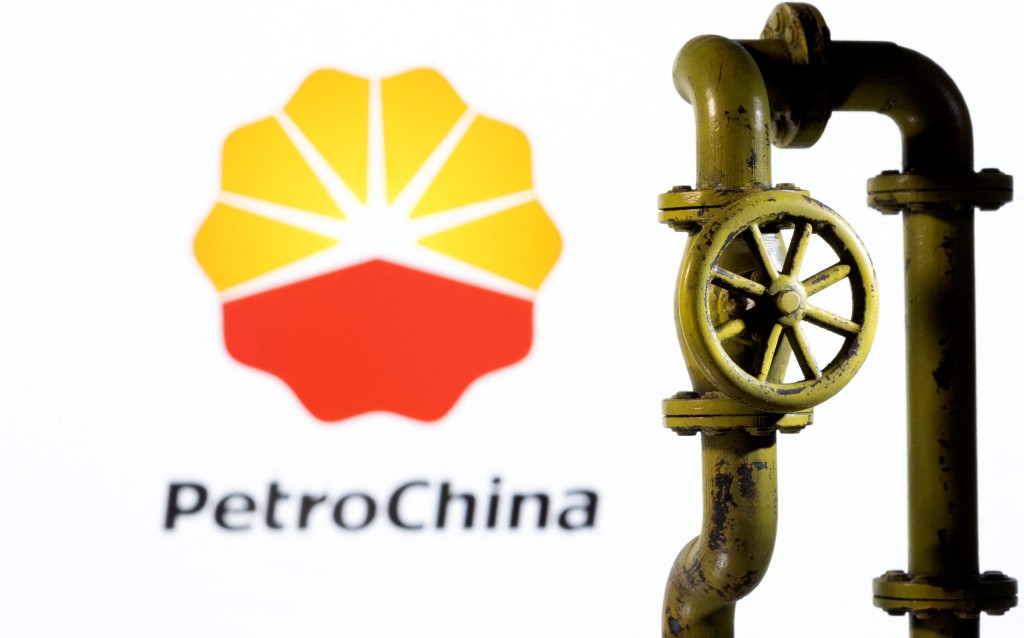 A 3D printed natural gas pipeline is placed in front of displayed PetroChina logo in this illustration taken February 8, 2022. REUTERS/Dado Ruvic/Illustration