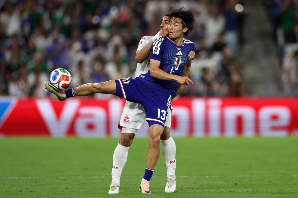 Japan's midfielder #13 Keito Nakamura and Tunisia's defender #20 Yan Valery fight for the ball during the 2026 World Cup Group F football match between Tunisia and Japan (AFP)
