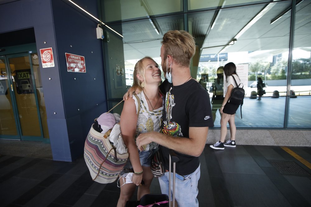 Andrea Monti hugs his girlfriend Katherina Scherf who just arrived from Duesseldorf, Germany at Rome's Fiumicino airport, Wednesday, June 3. Andrea Monti hugs his girlfriend Katherina Scherf who just arrived from Duesseldorf, Germany at Rome's Fiumicino airport, Wednesday, June 3.