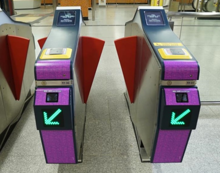 Gates at MTR stations for QR code payment will be wrapped with prominent purple stickers for easy identification. Gates at MTR stations for QR code payment will be wrapped with prominent purple stickers for easy identification.