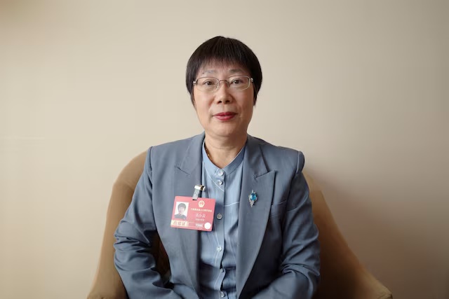 National People's Congress (NPC) delegate and Tsinghua University professor Wang Xiaoyun poses for a picture during a Reuters interview in Beijing, China March 10, 2026. REUTERS/Laurie Chen