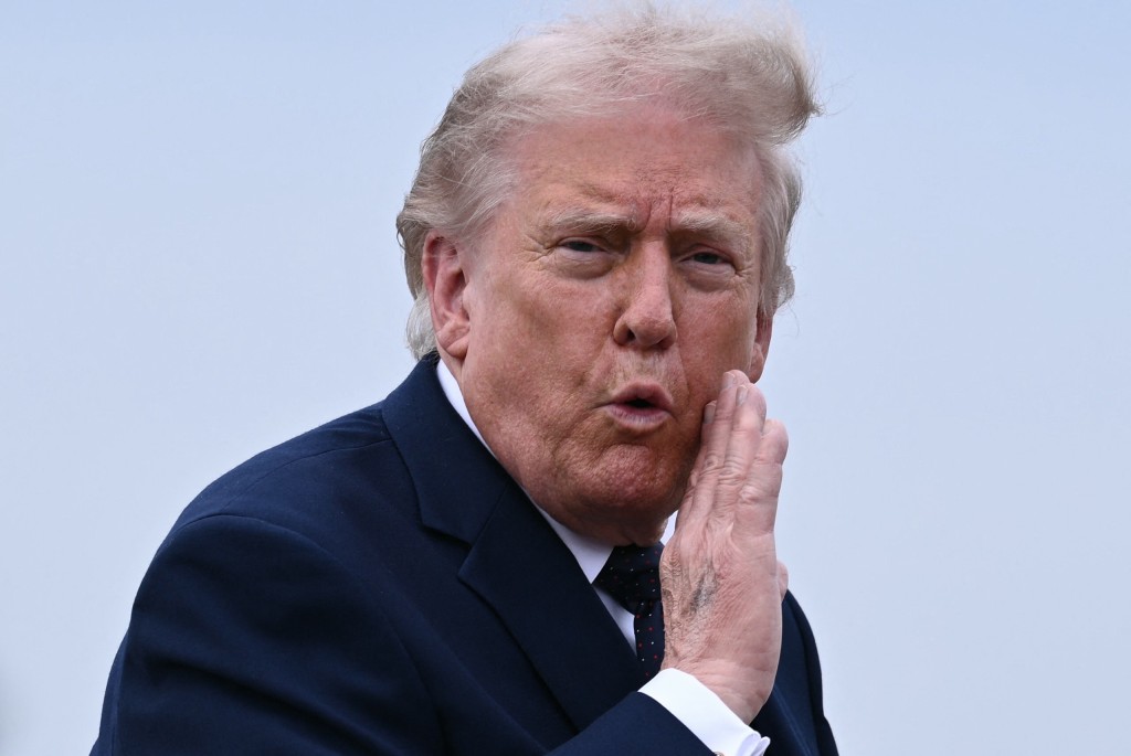 US President Donald Trump gestures as he walks to board a plane at Morristown Airport in Morristown, New Jersey, on May 22, 2026. (AFP)