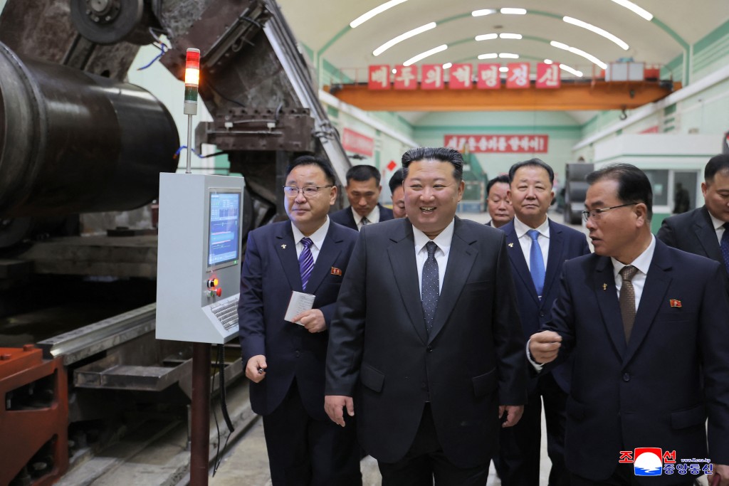 North Korean leader Kim Jong Un (C) visiting major munitions industry enterprises to acquaint himself with the missile and shell production at an undisclosed place in North Korea. (AFP)