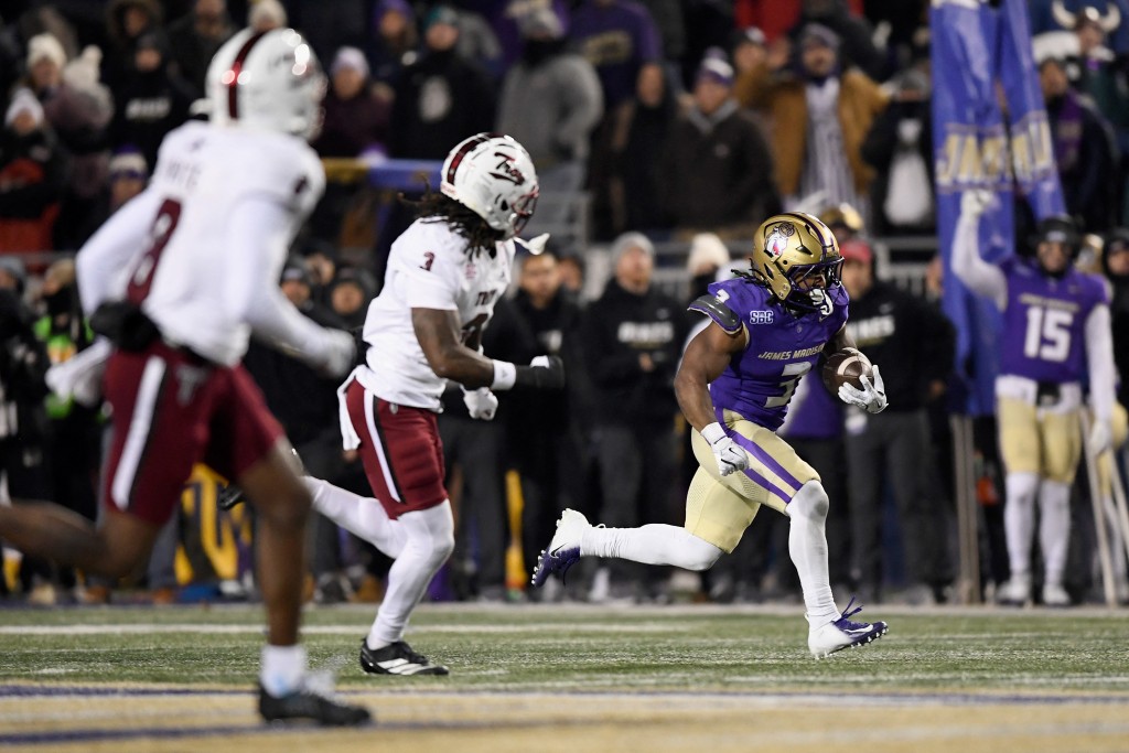 Photo by HANNAH FOSLIEN / GETTY IMAGES NORTH AMERICA / GETTY IMAGES VIA AFP. Wayne Knight #3 of the James Madison Dukes carries the ball against the Troy Trojans during the fourth quarter of the game at Bridgeforth Stadium on December 05, 2025 in Harrisonburg, Virginia.