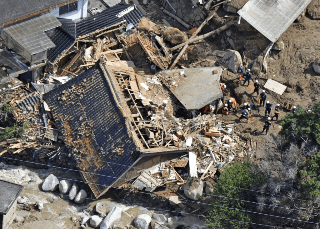Photo taken from a helicopter shows a search and rescue operation continuing at the site of a mudslide following heavy rain in Karatsu, Saga Prefecture, Japan in this photo taken by Kyodo on July 11, 2023. Mandatory credit Kyodo/via REUTERS 