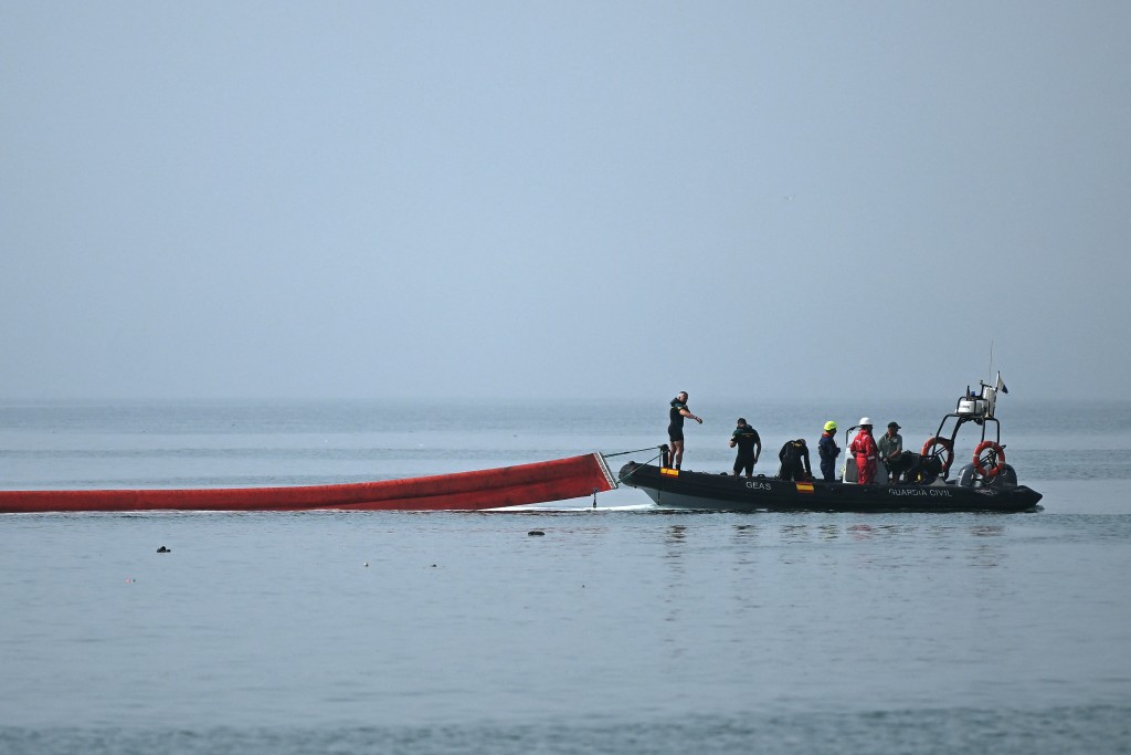 meter-long (1,640 feet) pneumatic barrier is deployed in the water by a Spanish Guardia Civil boat near the border post to reinforce security following illegal crossings from Morocco into the Spanish enclave of Ceuta, on August 1, 2026.