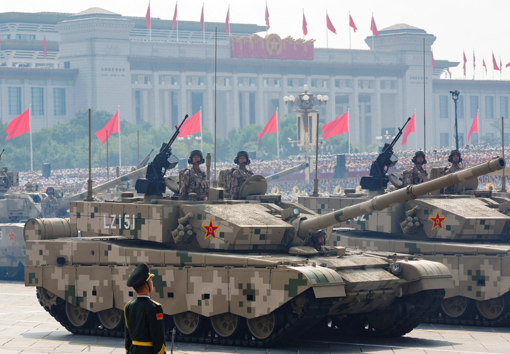 Members of the People's Liberation Army stand as the land operations group displays tanks during a military parade to mark the 80th anniversary of the end of World War Two, in Beijing, China, September 3, 2025. (Reuters)
