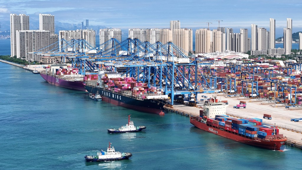 This aerial photo shows a general view of containers and cargo ships at Qingdao port, in China eastern Shandong province on June 2, 2026. (Photo by CN-STR / AFP) 