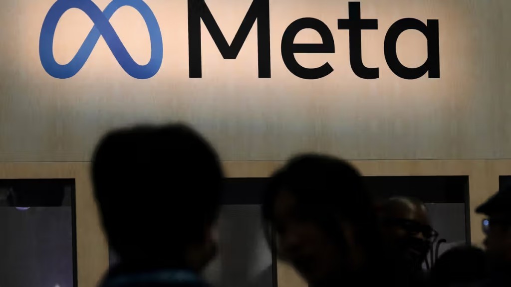 FILE - Attendees visit the Meta booth at the Game Developers Conference 2023 in San Francisco on March 22, 2023. (AP Photo/Jeff Chiu, File)