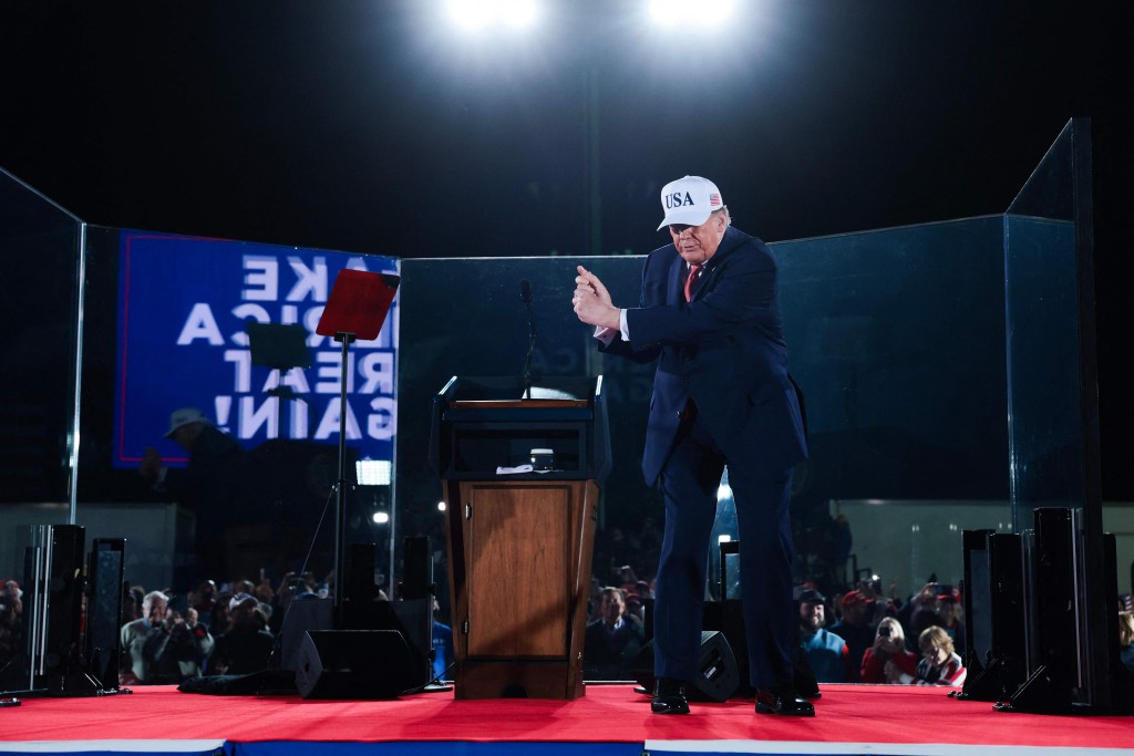 US President Donald Trump walks offstage after an election rally at Pitt-Greenville Airport on October 20. (AFP)