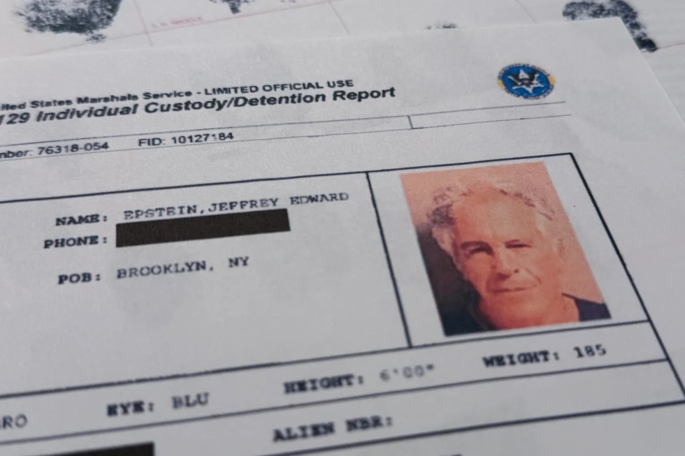 A document that was included in the U.S. Department of Justice release of the Jeffrey Epstein files is photographed Sunday, Feb. 1, 2026, shows the report when Epstein was taken into custody on July 6, 2019. (AP Photo/Jon Elswick)