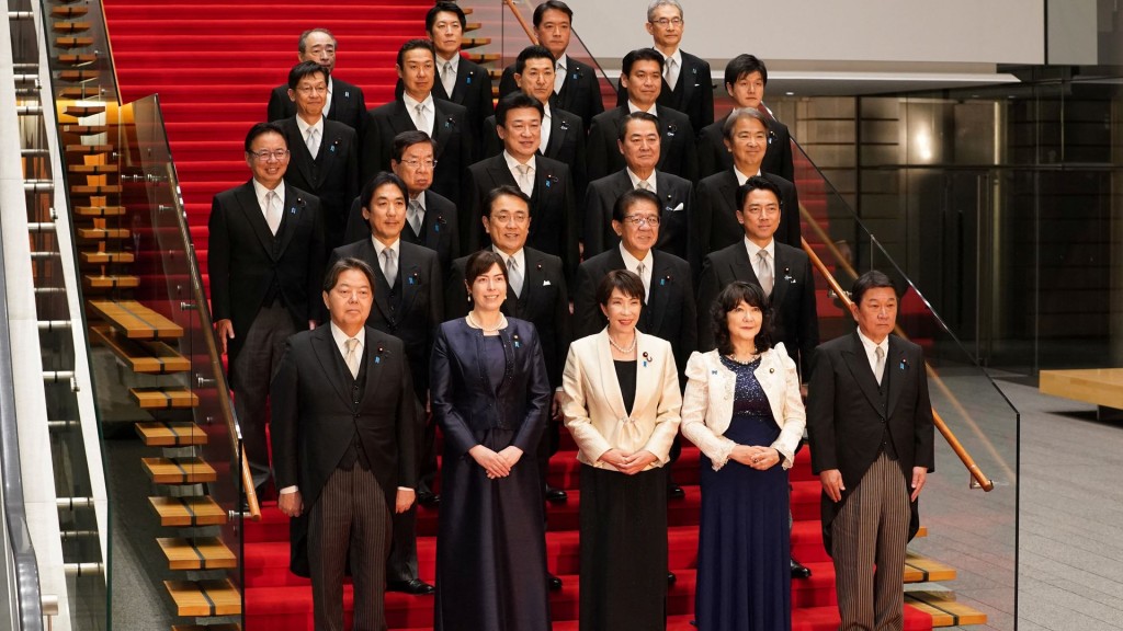 Japanese PM Takaichi and members of her new cabinet pose for a group photo, in Tokyo. AP