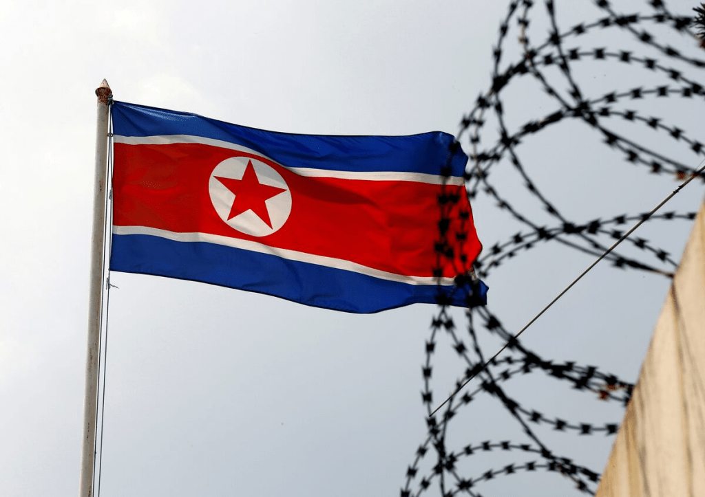 FILE PHOTO: A North Korea flag flutters next to concertina wire at the North Korean embassy in Kuala Lumpur, Malaysia March 9, 2017. REUTERS/Edgar Su/File Photo/File Photo