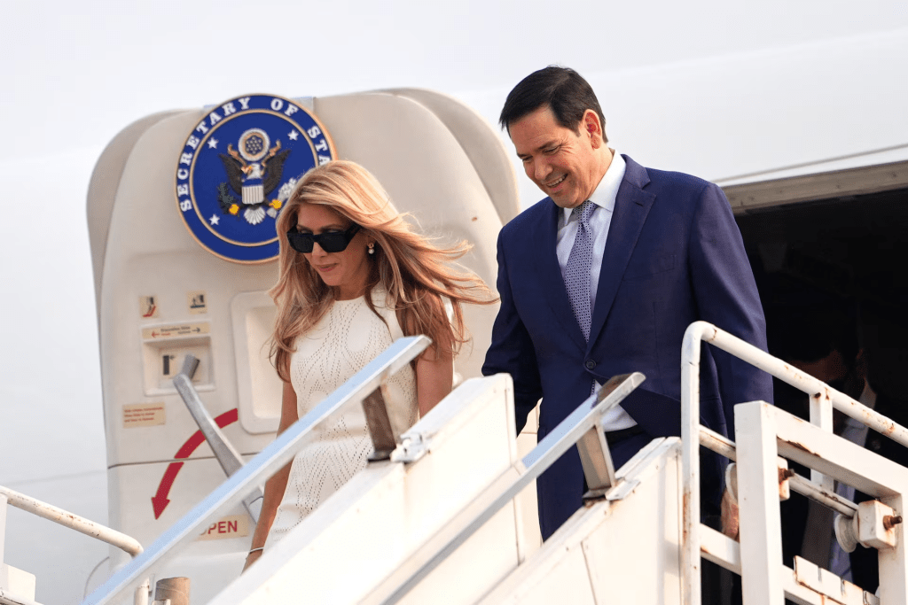 U.S. Secretary of State Marco Rubio disembarks his plane with his wife Jeanette at Netaji Subhash Chandra Bose International Airport in Kolkata, India, Saturday, May 23, 2026. Julia Demaree Nikhinson/Pool via REUTERS 