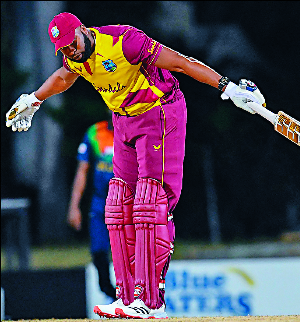 Kieron Pollard celebrates his feat in Antigua. AFP Kieron Pollard celebrates his feat in Antigua. AFP