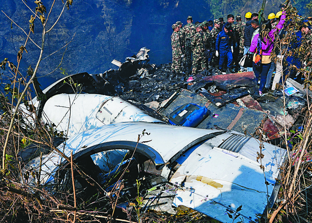 Rescue workers at the scene of the crash. Inset, a Yeti Airlines ATR 72-500. Reuters Rescue workers at the scene of the crash. Inset, a Yeti Airlines ATR 72-500. Reuters