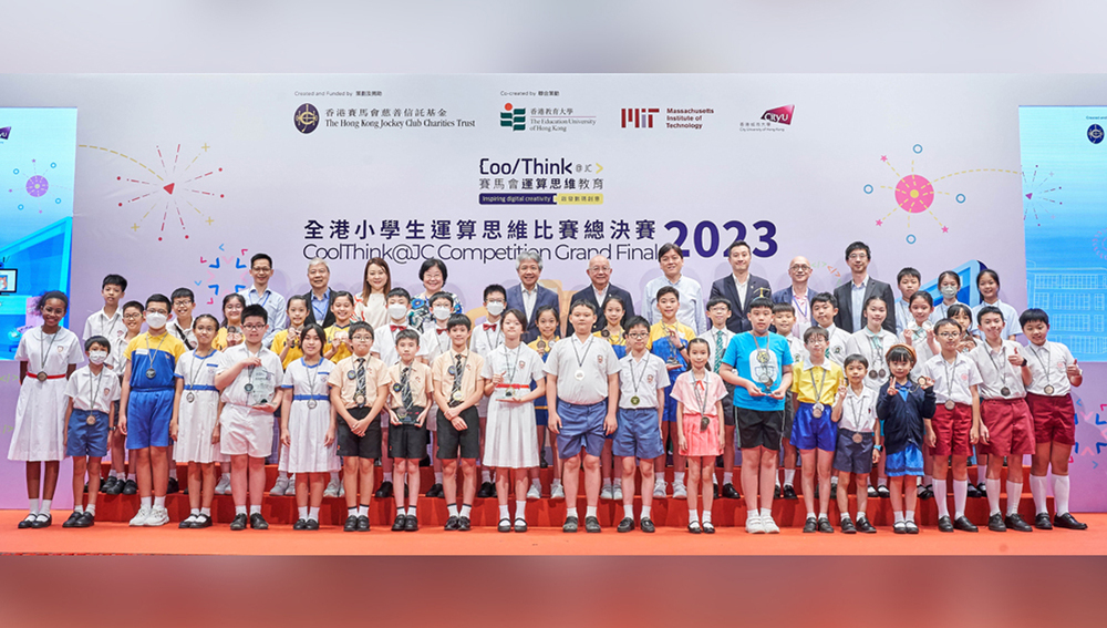 Primary school students stand proud with their winning medals at the awards presentation ceremony.