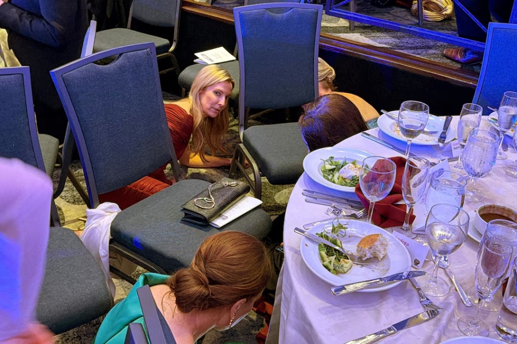  Guests take cover after President Trump and first lady Melania Trump were rushed out of the dinner. REUTERS/Evan Vucci
