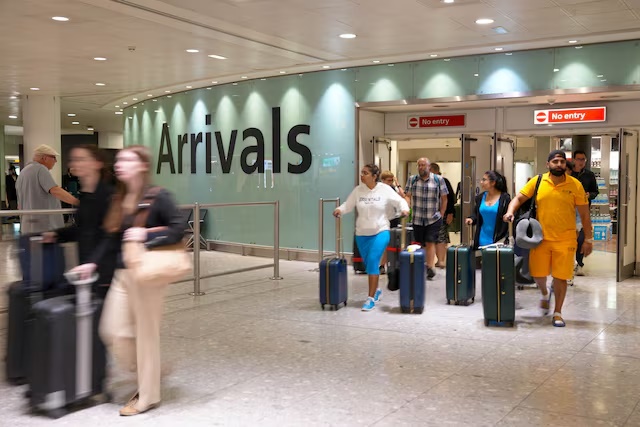 People arrive to London Heathrow Terminal 3 in London, Britain, August 22, 2023. REUTERS/Maja Smiejkowska 