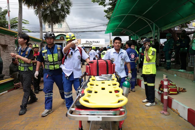 Emergency personnel work at Debsirin Nonthaburi School, the site of a shooting incident, in Bang Kruai district in Nonthaburi province on the outskirts of Bangkok, Thailand, August 7, 2026. REUTERS/Chalinee Thirasupa