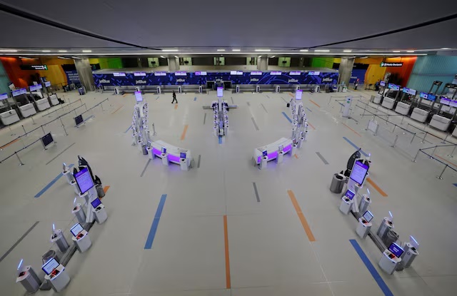 The JetBlue terminal is empty as most flights are cancelled at Logan International Airport during a winter blizzard snow storm in Boston, Massachusetts, U.S., February 23, 2026. REUTERS/Brian Snyder