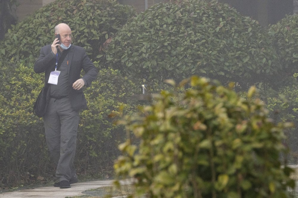 Peter Daszak makes a call on a foggy day before leaving his hotel with other members of a World Health Organization team for another day of field visit in Wuhan in central China's Hubei province Wednesday, February 3, 2021. 