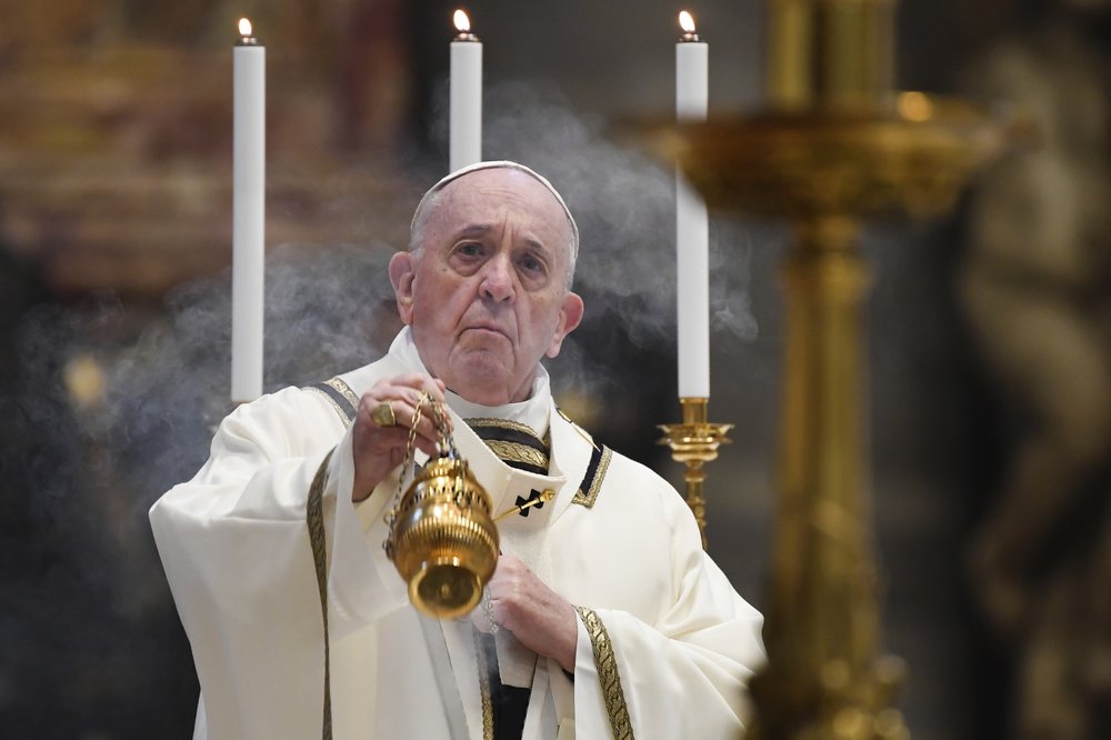 Pope Francis spreads incense at the start of Easter Sunday Mass, inside an empty St. Peter's Basilica at the Vatican. (Pool Photo via AP) Pope Francis spreads incense at the start of Easter Sunday Mass, inside an empty St. Peter's Basilica at the Vatican. (Pool Photo via AP)