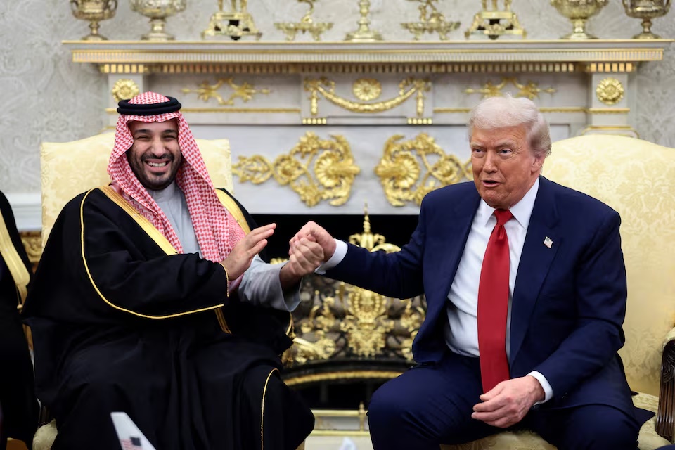U.S. President Donald Trump and Saudi Crown Prince and Prime Minister Mohammed bin Salman hold hands during a meeting in the Oval Office at the White House in Washington, D.C., U.S., November 18, 2025. REUTERS/Evelyn Hockstein/File Photo