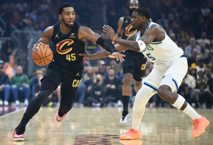 Donovan Mitchell, who scored 26 points, tries to dribble past Minnesota’s Anthony Edwards. REUTERS