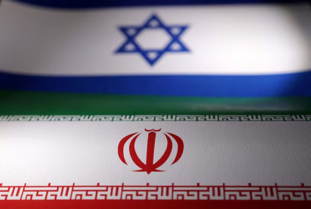 Israeli and Iranian flags are seen in this illustration taken, April 24, 2024. REUTERS/Dado Ruvic/Illustration/File Photo 