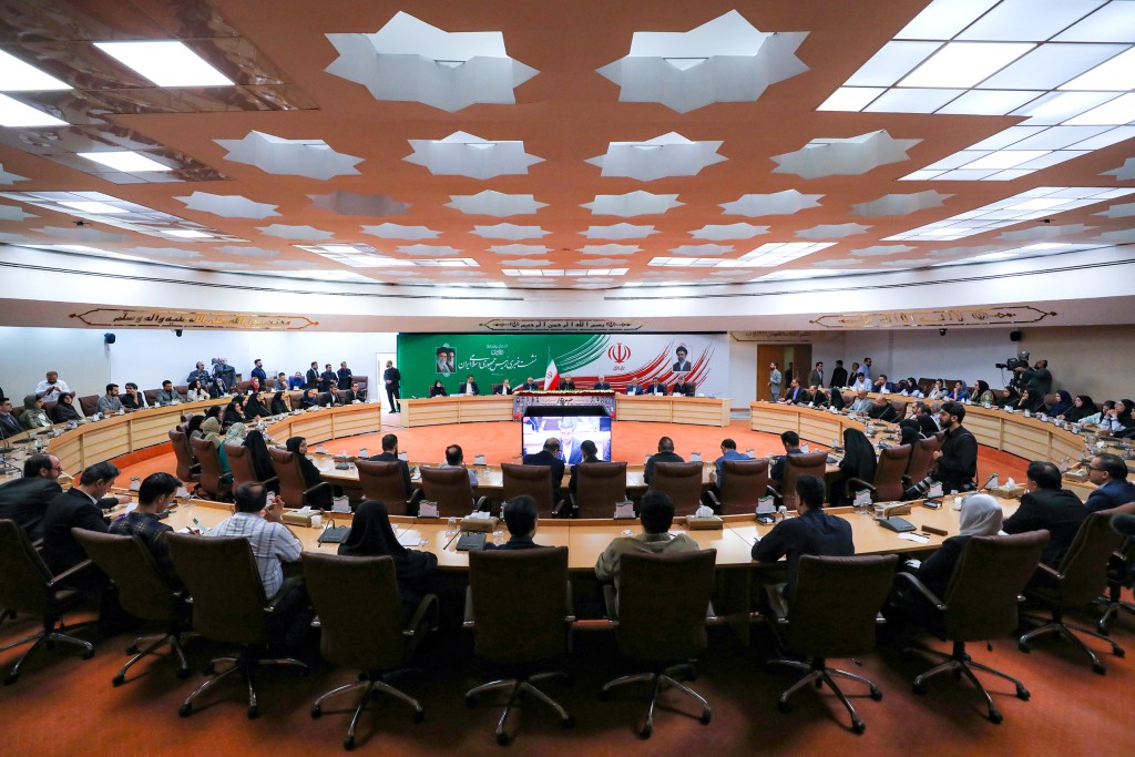 Iran's President Masoud Pezeshkian (C-back) attending a press conference in the capital Tehran, on August 8, 2026. (AFP)