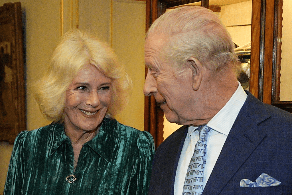 Britain's Queen Camilla and King Charles attend a reception for authors, members of the literary community and representatives from the Queen's Reading Room, to celebrate the first recipients of the Queen's Reading Room Medal, at Clarence House, in London, Britain, March 25, 2026. Aaron Chown/Pool via REUTERS/File Photo