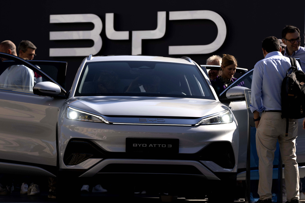 FILE - Visitors check the China made BYD ATTO 3 at the IAA motor show in Munich, Germany, on Sept. 8, 2023. (AP Photo/Matthias Schrader, File) FILE - Visitors check the China made BYD ATTO 3 at the IAA motor show in Munich, Germany, on Sept. 8, 2023. (AP Photo/Matthias Schrader, File)