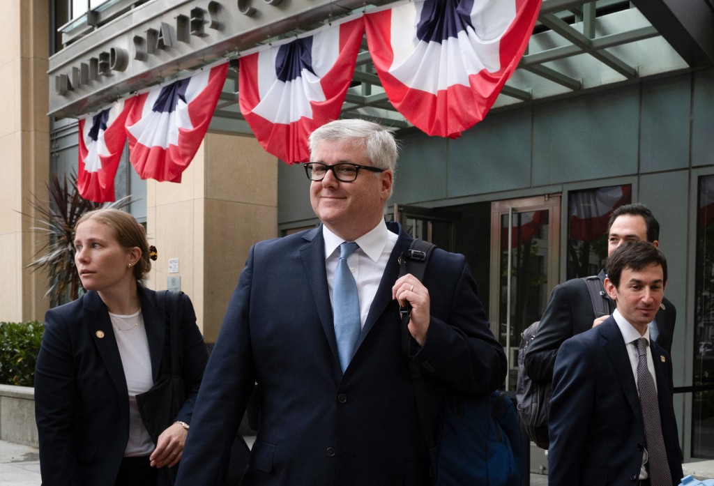Photo by KARL MONDON / AFP  Nicklas Akers (C), senior assistant Attorney General in charge of the Consumer Protection Section of the California Department of Justice, departs the Ronald V. Dellums Federal Building and United States Courthouse after a settlement was announced in the Meta trial, in Oakland, California, on August 26, 2026.