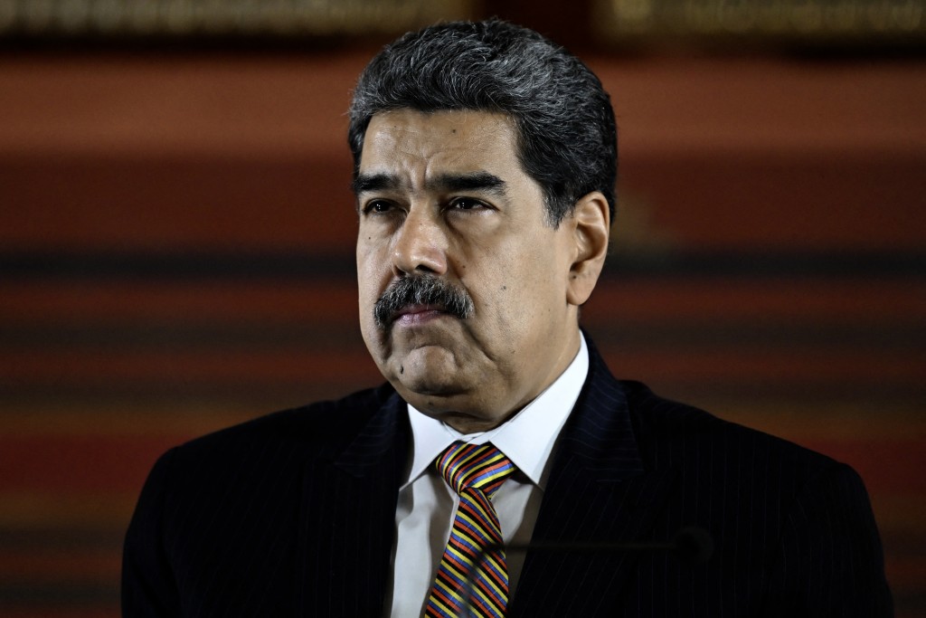 Photo by JUAN BARRETO / AFP. Venezuela's President Nicolas Maduro looks on during a meeting at the National Assembly in Caracas on August 22, 2025.