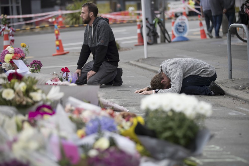 In this March 19, 2019, file photo, mourners pray near the Linwood mosque in Christchurch, New Zealand. In this March 19, 2019, file photo, mourners pray near the Linwood mosque in Christchurch, New Zealand.