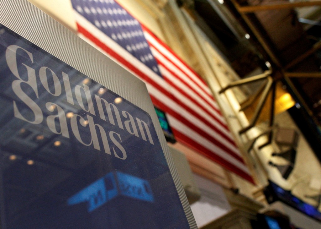 FILE PHOTO: A Goldman Sachs sign is seen above their booth on the floor of the New York Stock Exchange, January 19, 2011. REUTERS/Brendan McDermid//File Photo