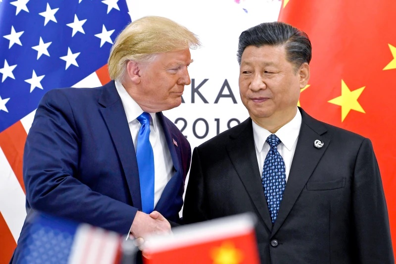 President Donald Trump, left, shakes hands with China’s President Xi Jinping during a meeting on the sidelines of the G-20 summit in Osaka, Japan, June 29, 2019. (AP Photo/Susan Walsh, File)