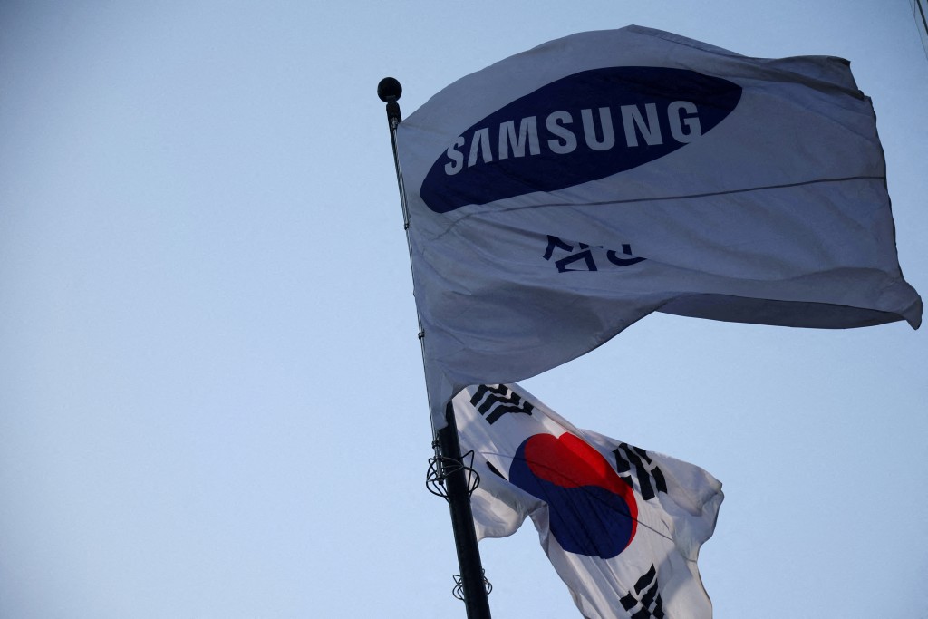A flag bearing the logo of Samsung Electronics flutters at the company's office building in Seoul, South Korea, April 15, 2025.   REUTERS