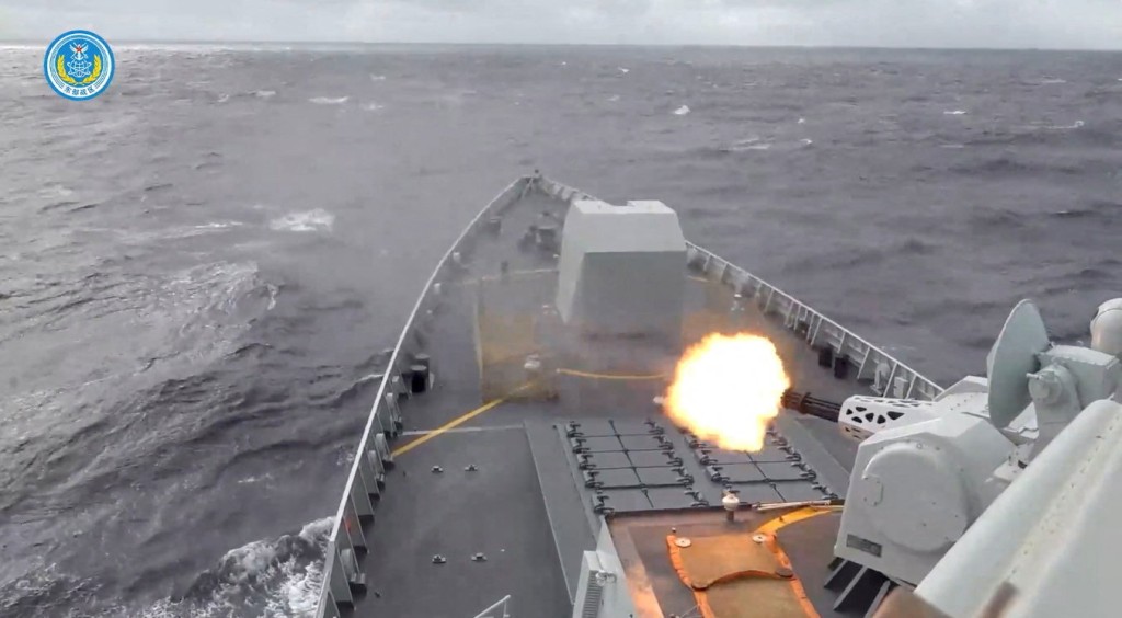 A ship fires a weapon during drills east of Taiwan, in this screenshot from a video released by the Eastern Theatre Command of China's People's Liberation Army (PLA) on December 29, 2025. (Reuters)