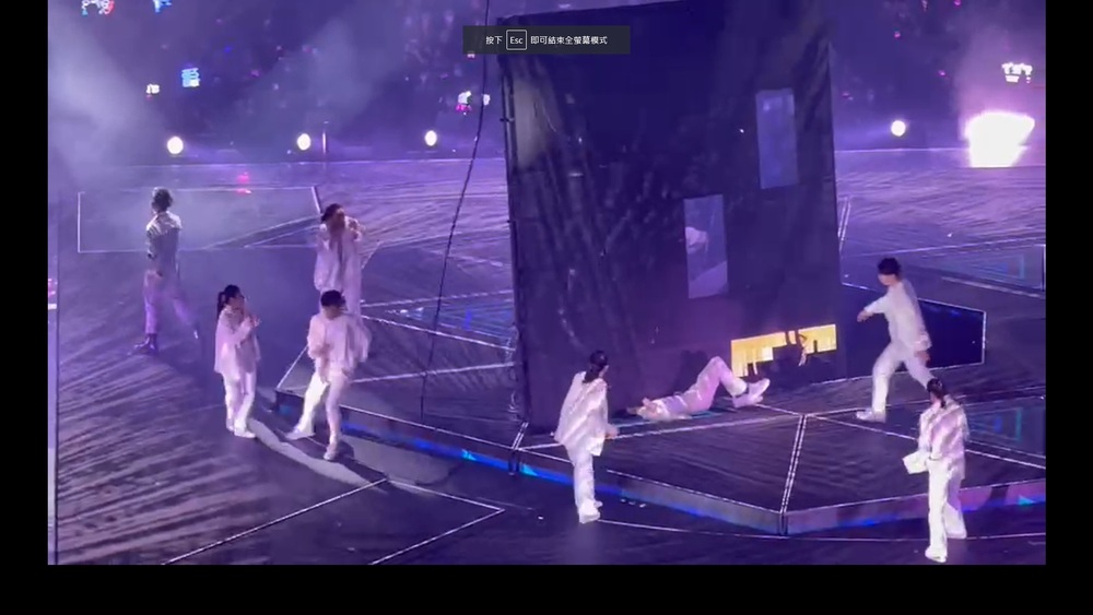 The large visual display screen tearing loose from its tether, falling to the ground and crushing two dancers below. (Sing Tao file)