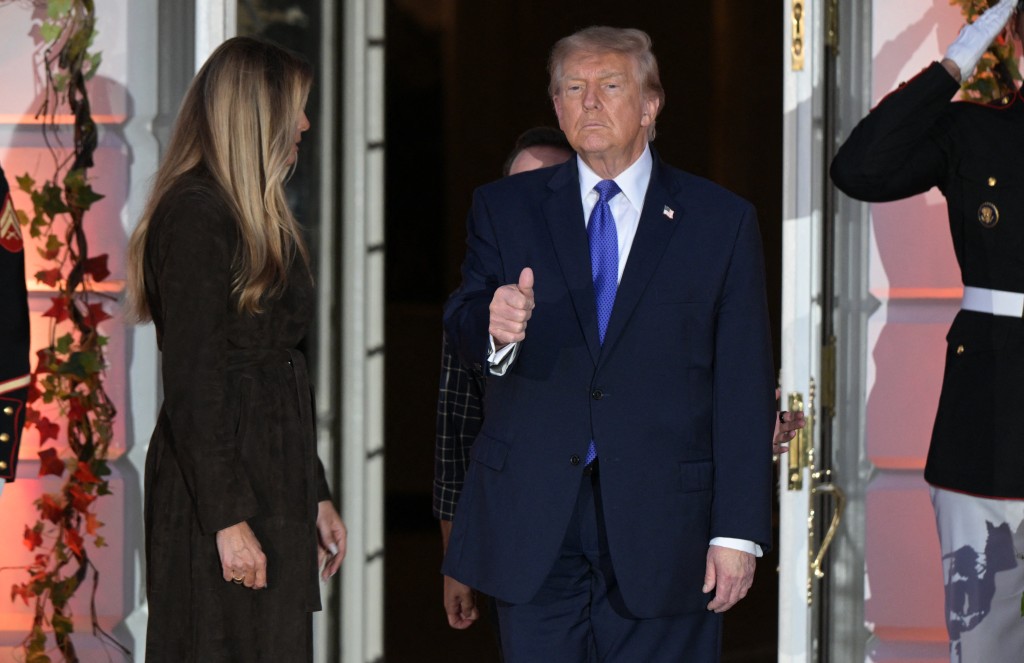 US President Donald Trump gives a thumbs up after handing out candy with US First Lady Melania Trump to children during a Halloween party at the White House in Washington, DC, on October 29, 2026. (Photo by Oliver Contreras / AFP)