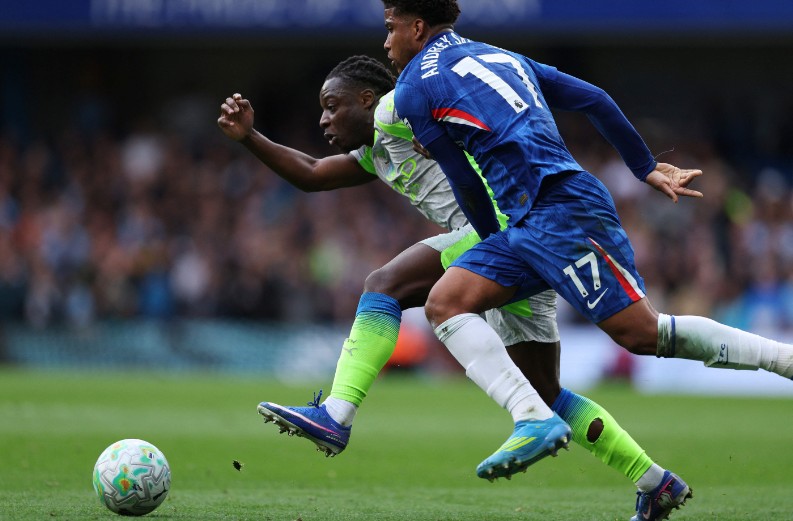 Jeremy Doku is challenged by Chelsea midfielder Andrey Santos during the match at Stamford Bridge. AFP 